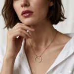 Gold plated necklace with hammered round pendant