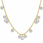 Gold sapphire necklace close up on female model